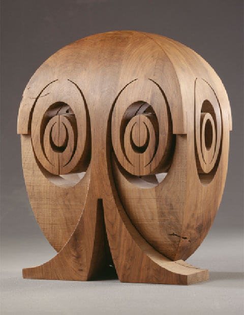 Elliptisch- animale Figur mit 2 Gesichtern, Nussbaumholz, 48 x 35 x 26 cm